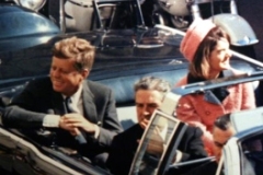 Minutes before the assassination: John F. Kennedy, his wife Jacqueline and the Governor of Texas in the convertible presidential limousine.