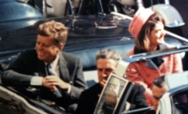 Minutes before the assassination: John F. Kennedy, his wife Jacqueline and the Governor of Texas in the convertible presidential limousine.
